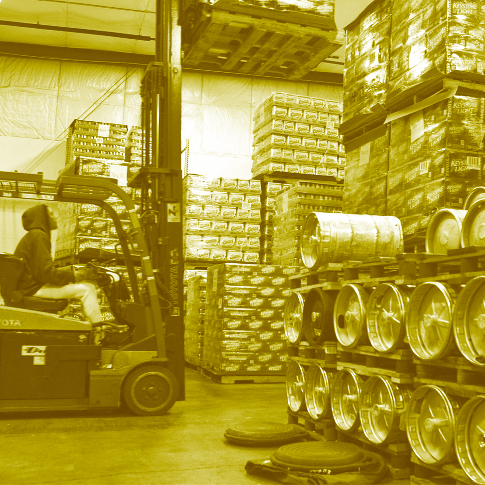 Image of an employee operating a forklift in a warehouse